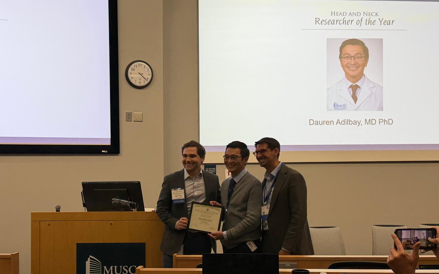 Dr. Adilbay receiving the Head and Neck Researcher of the Year award at MUSC